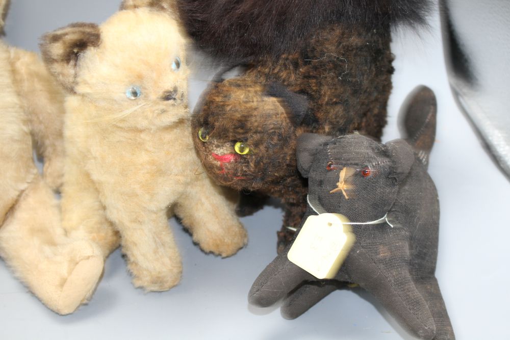 A collection of nine assorted vintage and later soft toy cats including Steiff